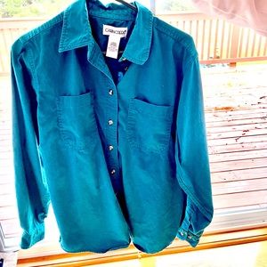Women’s turquoise button down top.